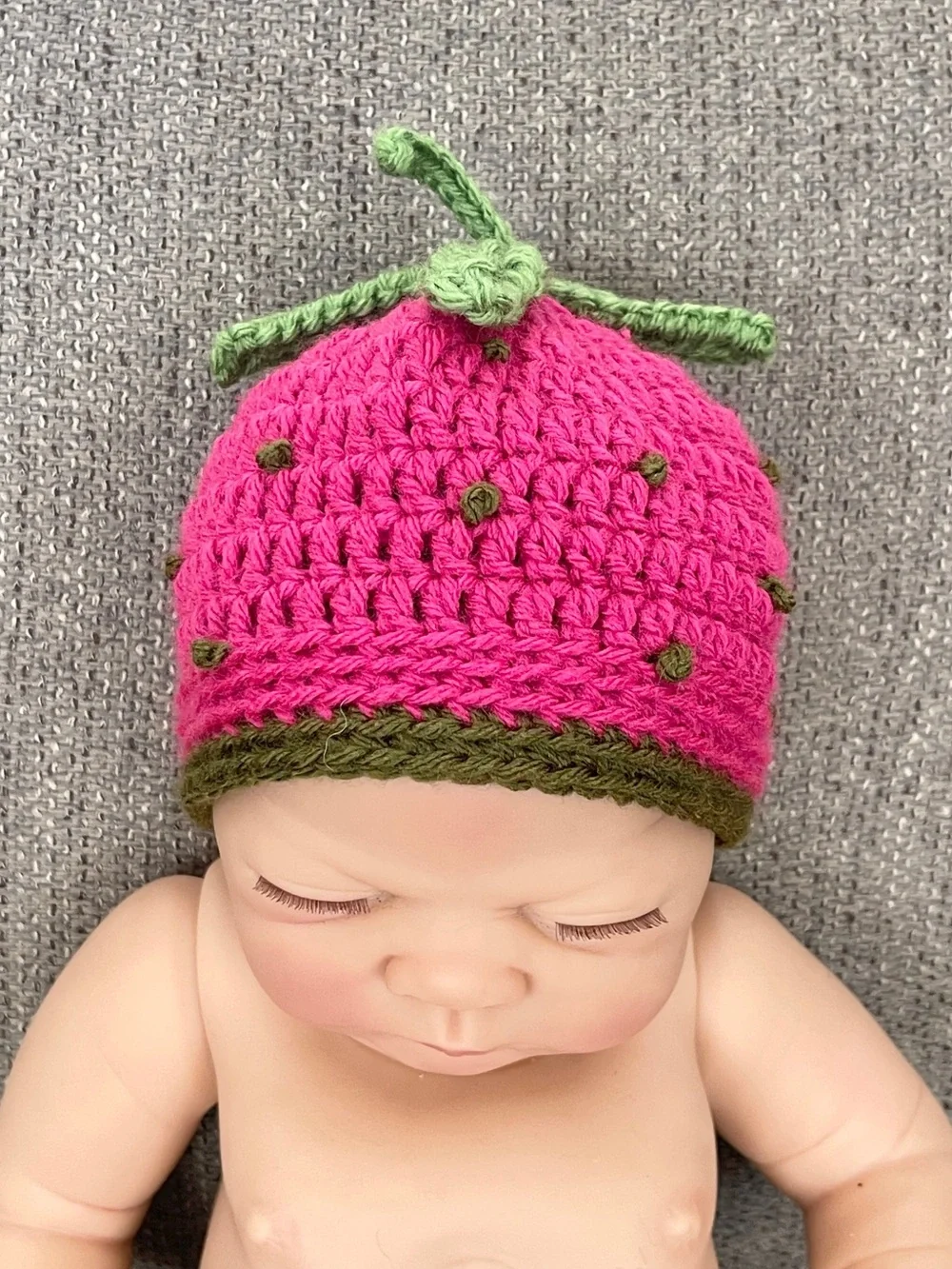 Raspberry Crochet Baby Hat with Green Leaf Accent